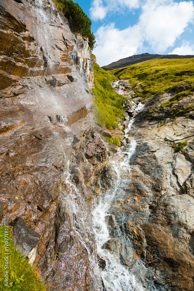 Waterfall at the Grossglockner High Alpine Road in the European Alps
