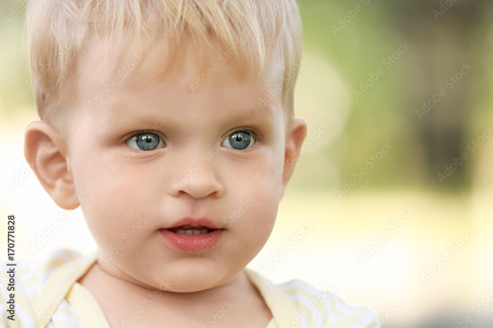 Cute baby boy on blurred background Cute baby boy on blurred background