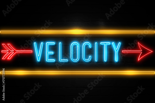 Velocity  - fluorescent Neon Sign on brickwall Front view photo