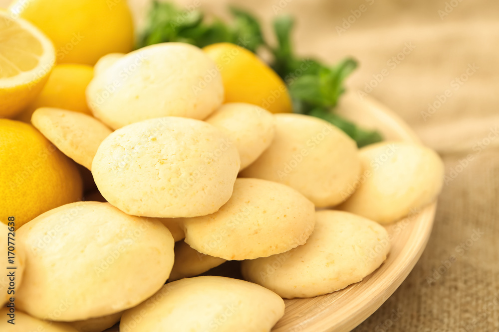 Plate with homemade lemon cookies on table, closeup Plate with homemade lemon cookies on table, closeup