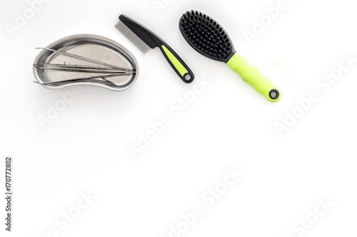 pets cure with tweezers for treatment set on white background top view mock up