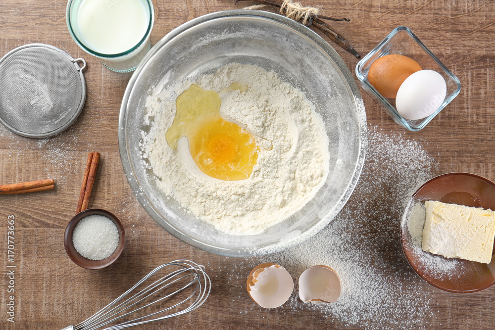 Cooking dough for vanilla cake on wooden background Cooking dough for vanilla cake on wooden background