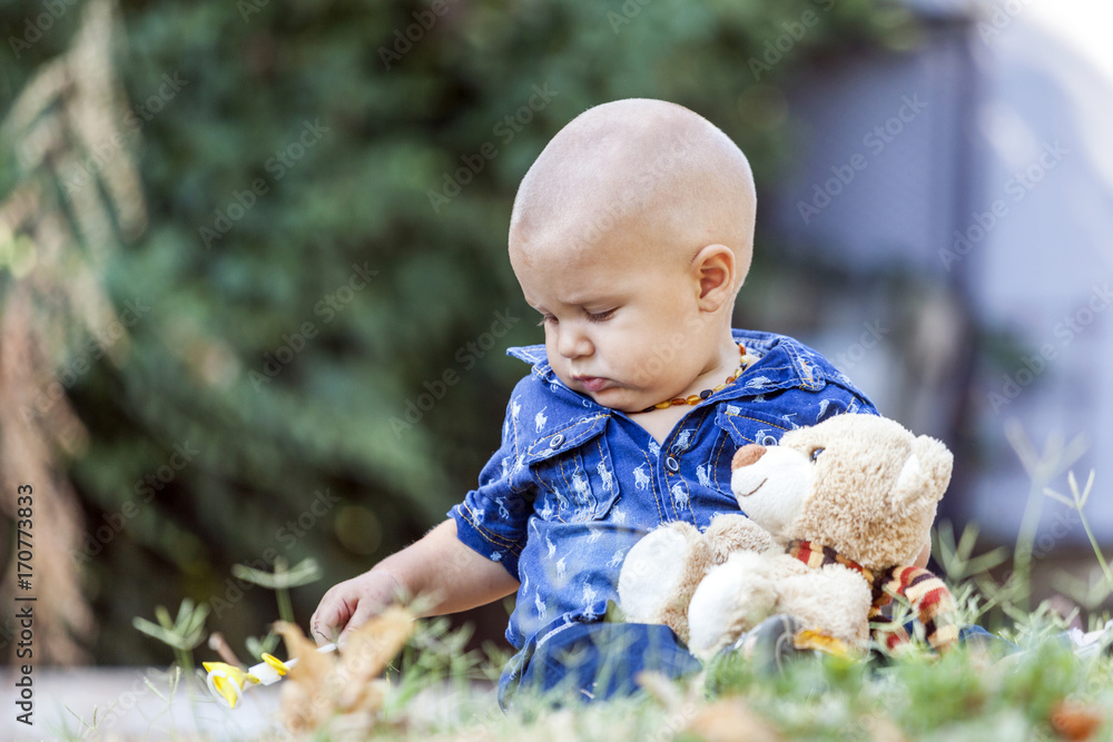 Portrait of a sweet little boy while playing with his favorite toy Portrait of a sweet little boy while playing with his favorite toy