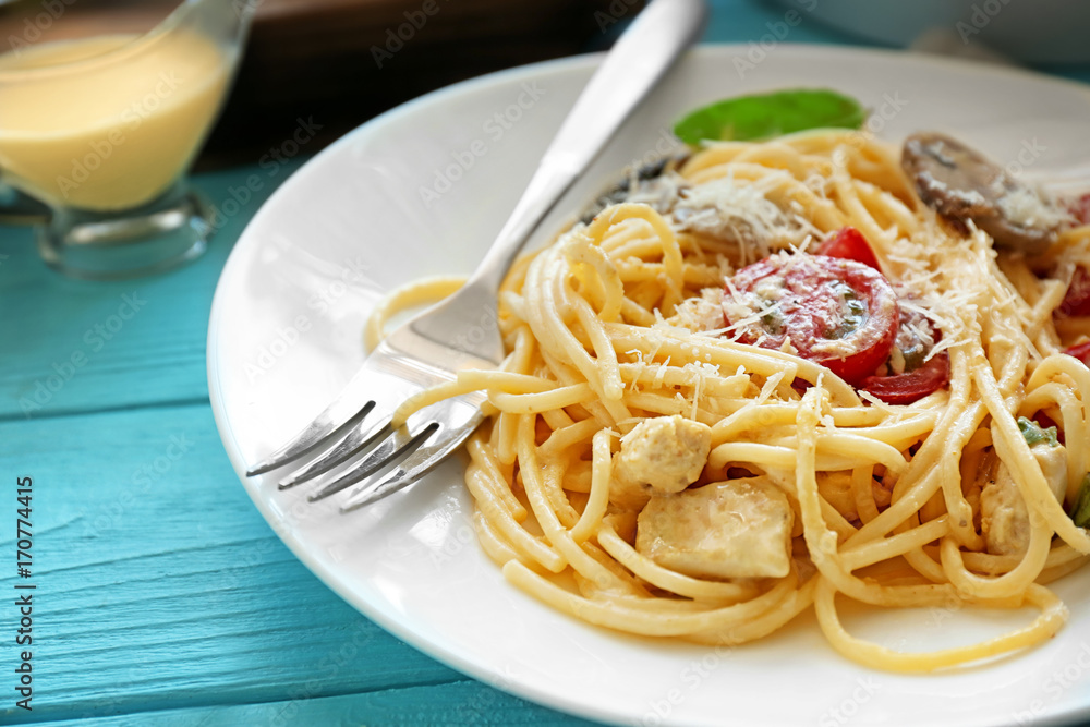 Plate with delicious roasted turkey tetrazzini on table Plate with delicious roasted turkey tetrazzini on table