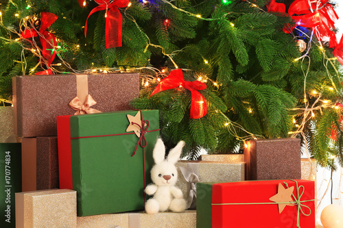 Beautiful Christmas composition with fir tree and gift boxes