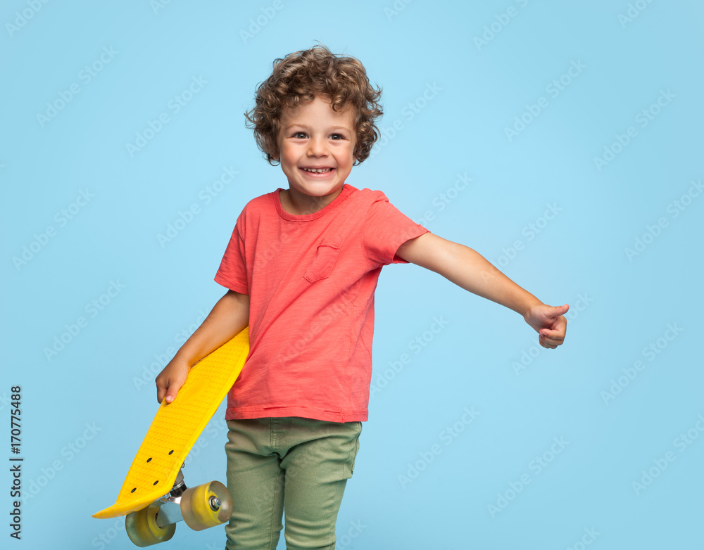Stylish boy with yellow longboard Stylish boy with yellow longboard