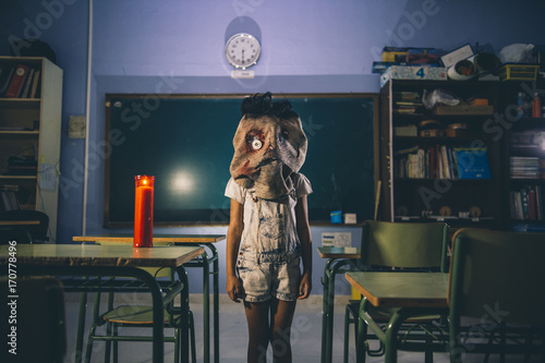 Child in scarecrow mask photo