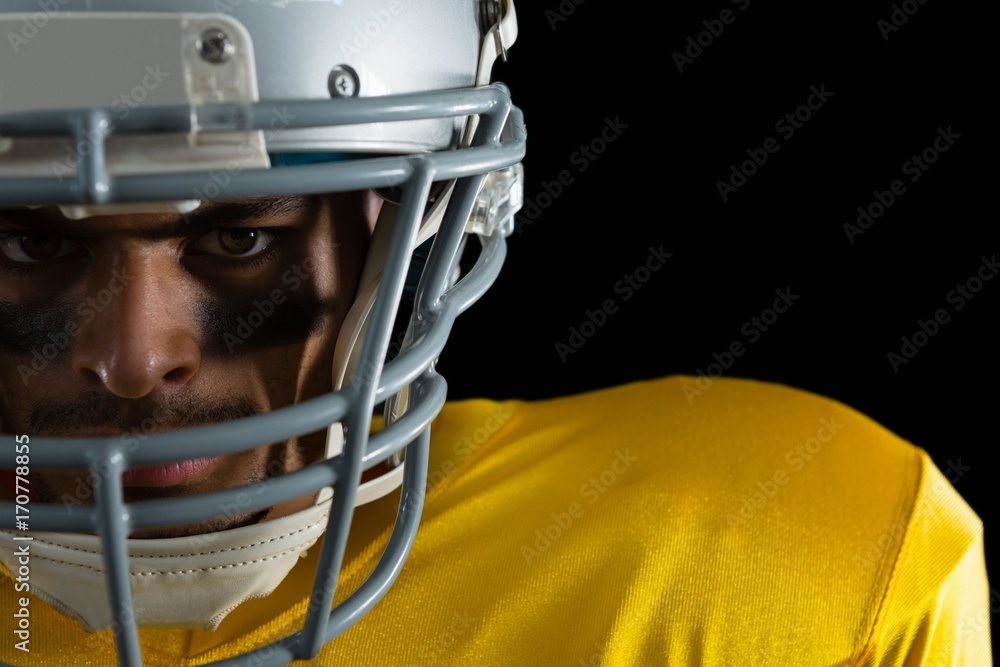 American football player with a head gear American football player with a head gear