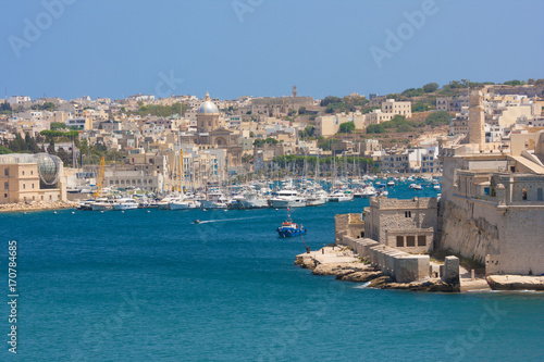 malta boats near church with domed roof