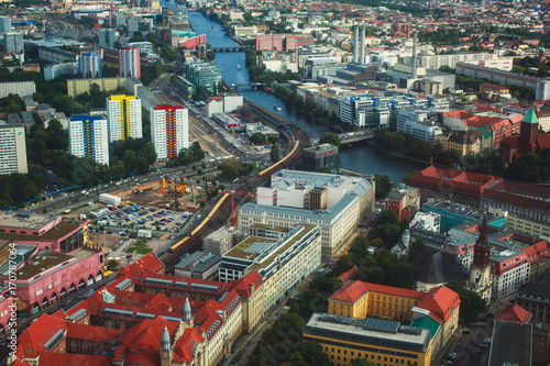 Aerial view of Berlin with skyline and scenery beyond the city, Germany, seen from the observation deck of TV tower photo