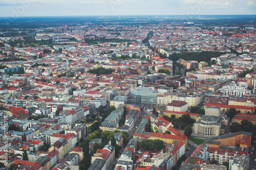 Aerial view of Berlin with skyline and scenery beyond the city, Germany, seen from the observation deck of TV tower
