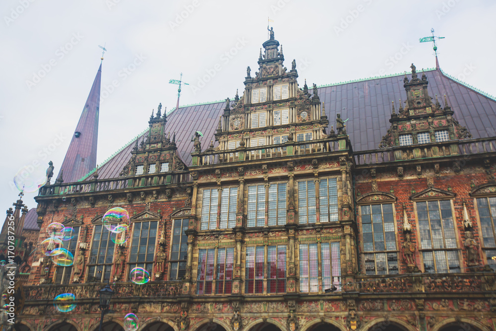 View of Bremen market square with Town Hall, Roland statue and crowd of people, historical center, Germany