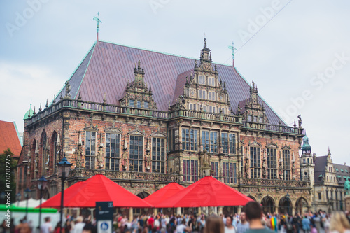 View of Bremen market square with Town Hall, Roland statue and crowd of people, historical center, Germany photo