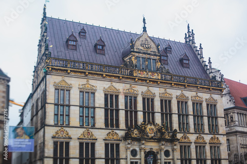 View of Bremen market square with Town Hall, Roland statue and crowd of people, historical center, Germany