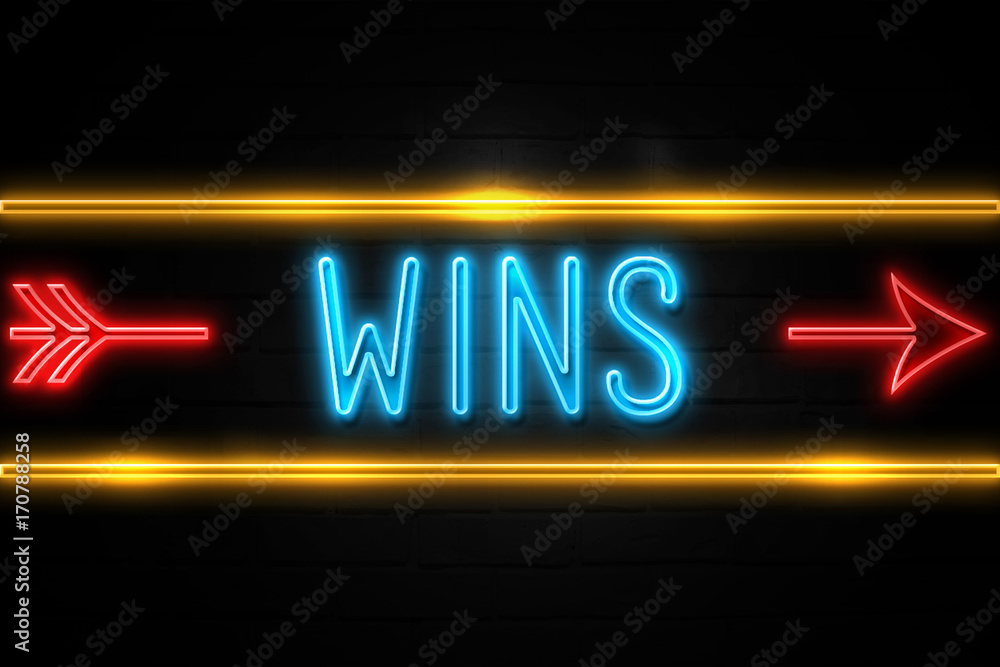 Wins - fluorescent Neon Sign on brickwall Front view Wins - fluorescent Neon Sign on brickwall Front view