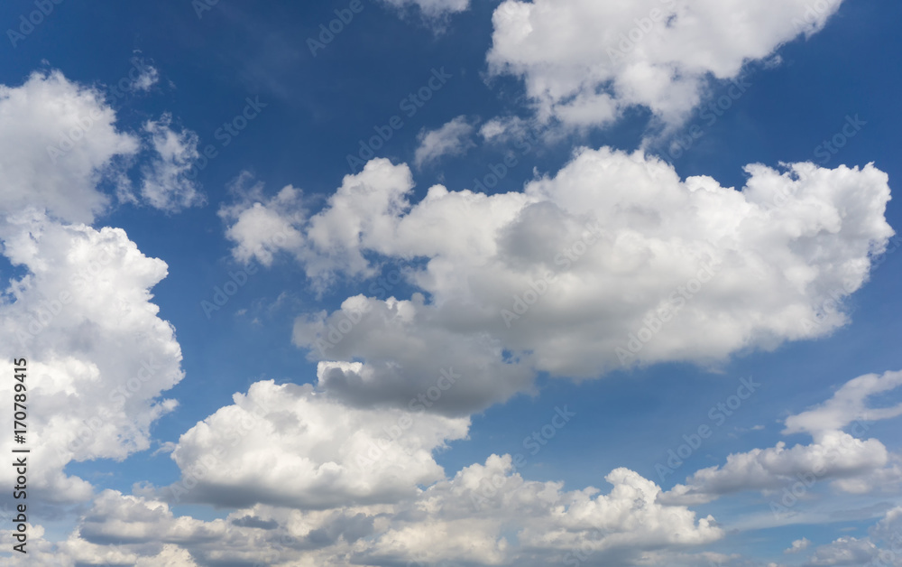 A lot of cumulus clouds on the blue sky background A lot of cumulus clouds on the blue sky background