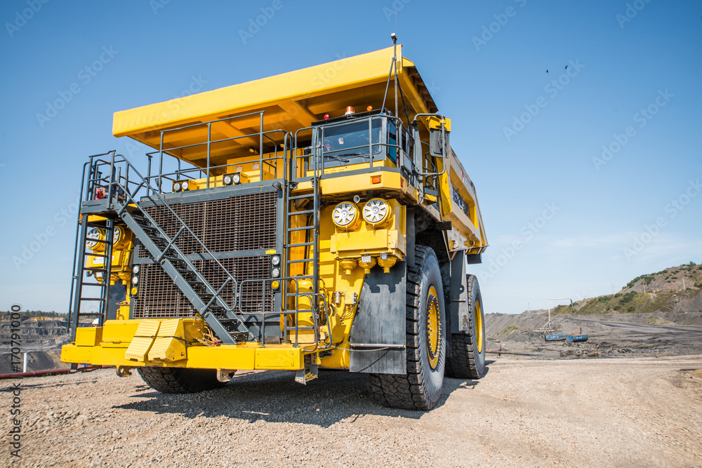 Big yellow mining truck at worksite
Big yellow mining truck at worksite