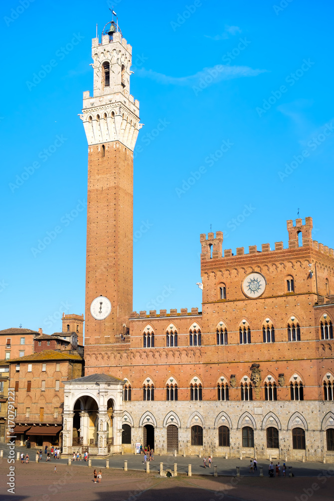 The Palazzo Publico at Piazza del Campo on the city of Siena, Italy