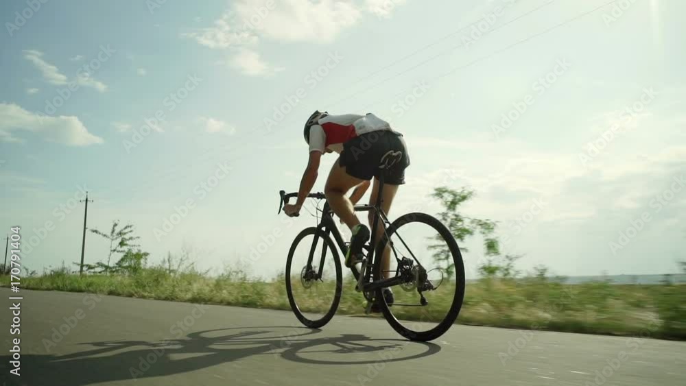 Young bicyclist riding bike single track green route sunset rapid slow motion Young bicyclist riding bike single track green route sunset rapid slow motion