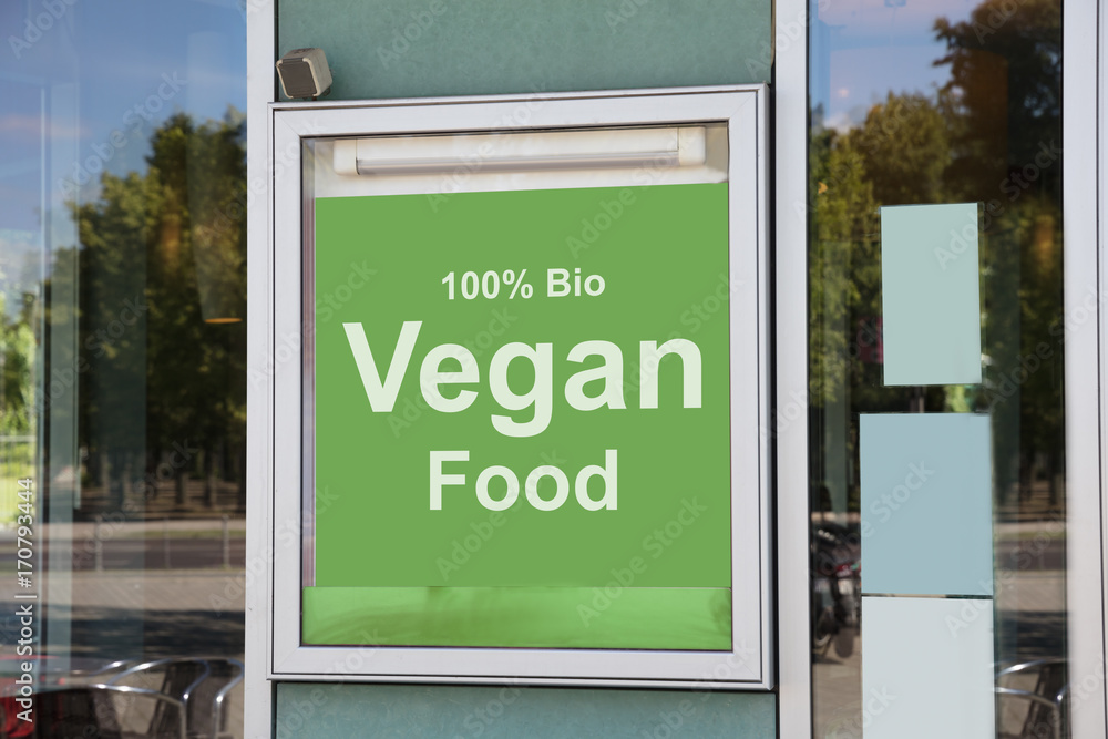 Obraz premium Vegan food sign outside modern restaurant building