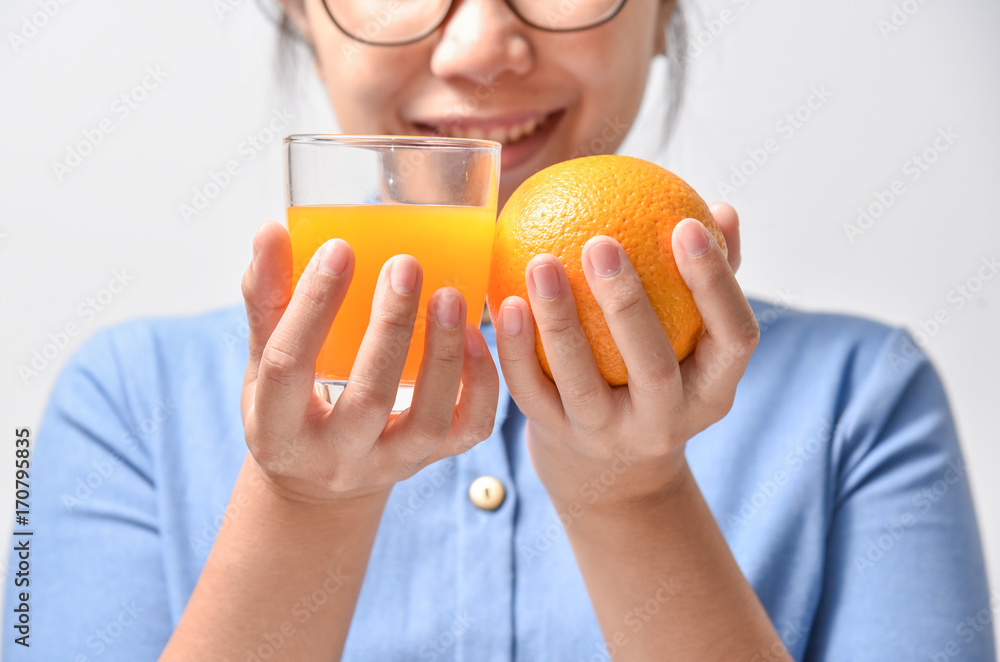 Orange with Orange juice in hands. Orange with Orange juice in hands.