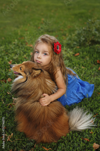 Little girl with a dog Sheltie