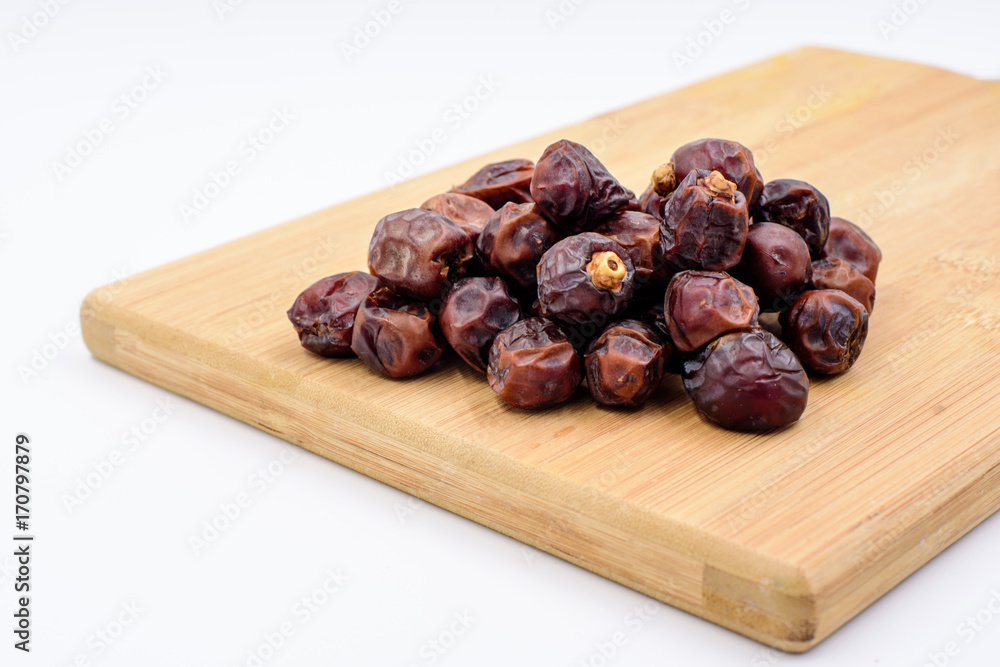 Dried dates on a chopping board Dried dates on a chopping board