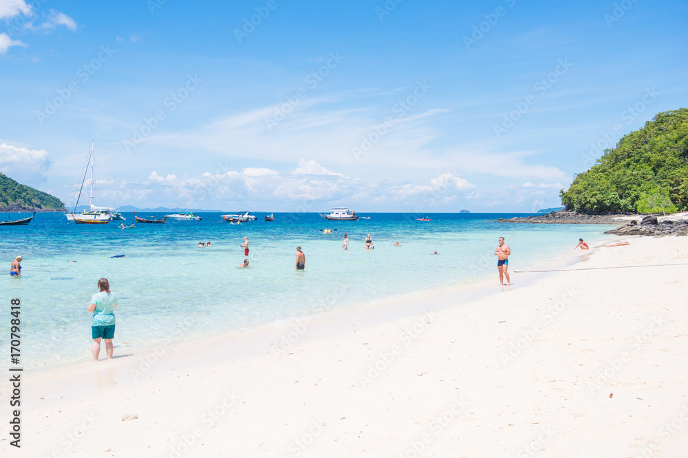 Tourists relaxing on the beach of the banana beach, coral island, Koh Hey in Phuket