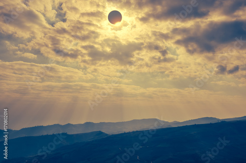 Scientific natural phenomenon. Total solar eclipse with diamond ring effect glowing on sky.