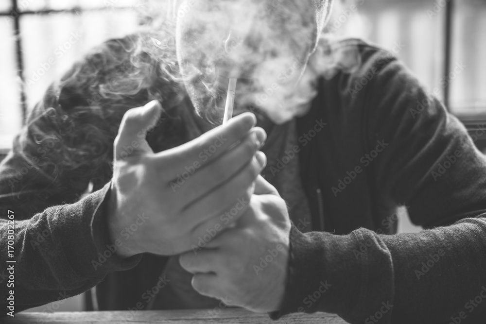 A man smoking a cigarette 