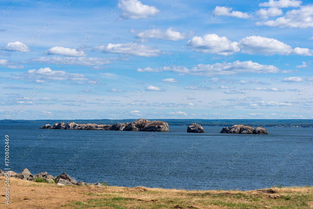 Rocky islands off the coast in Dalhousie, New Brunswick Rocky islands off the coast in Dalhousie, New Brunswick