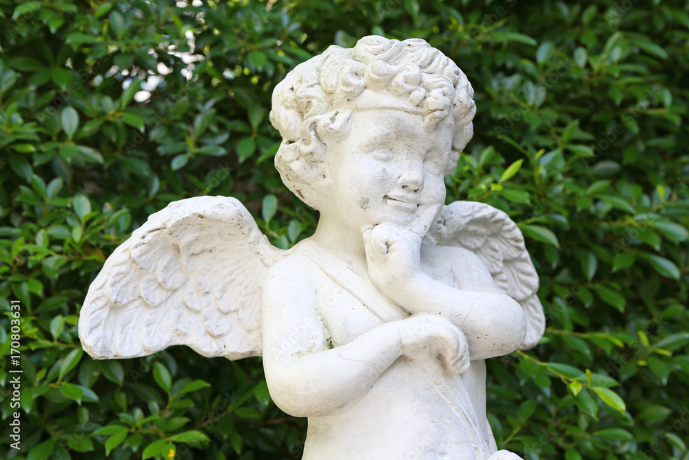 Cupid sculpture in the garden.
