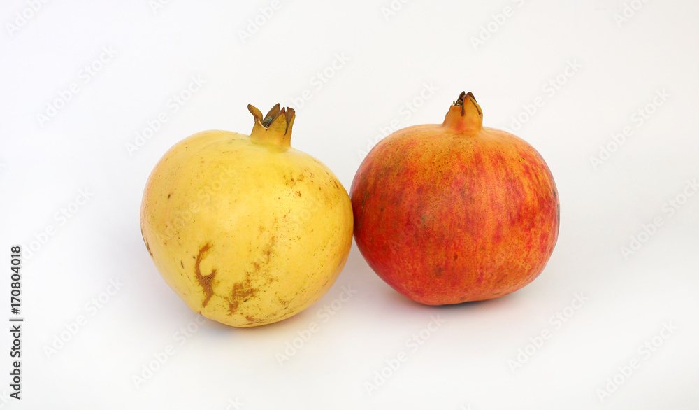 ripe pomegranate fruits isolated on white background. ripe pomegranate fruits isolated on white background.