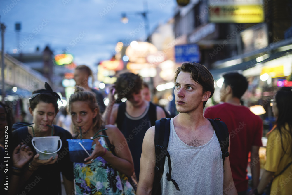Group of tourist enjoy bucket drinks in Khao San Road Bangkok Thailand walking street Group of tourist enjoy bucket drinks in Khao San Road Bangkok Thailand walking street