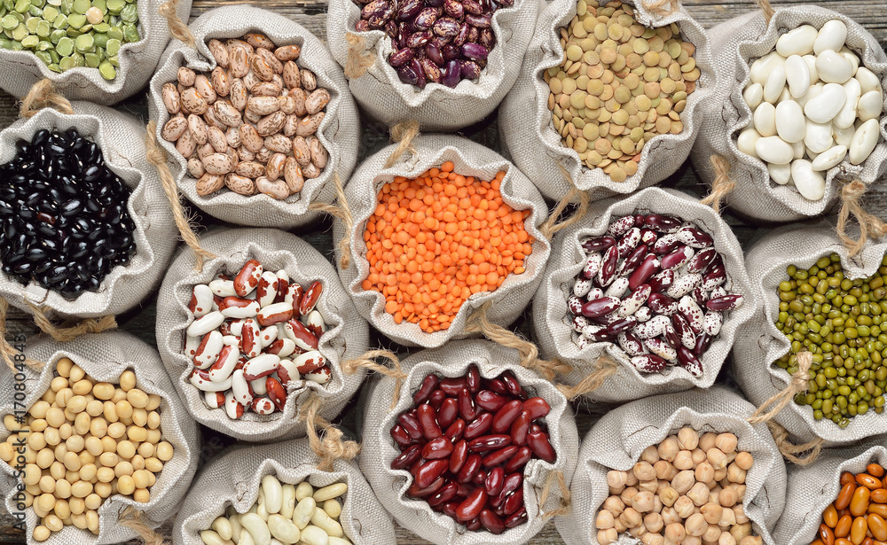Various dry legumes in a sack cloth, Different dry legumes for background. Top view. Various dry legumes in a sack cloth, Different dry legumes for background. Top view.