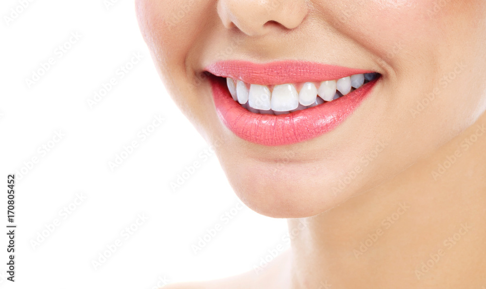 Obraz premium Closeup shot of woman's smile with white healthy teeth, isolated on white background