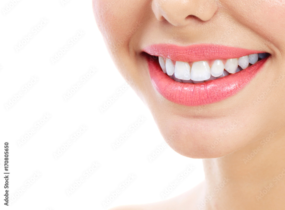 Obraz premium Closeup shot of woman's smile with white healthy teeth, isolated on white background