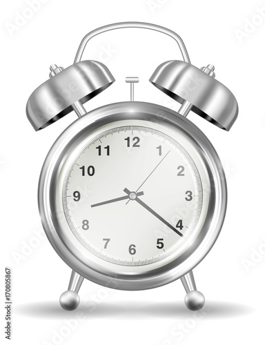 real silver alarm clock on a white background
