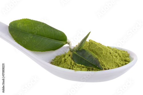 matcha powder in White ceramic spoon isolated on white background