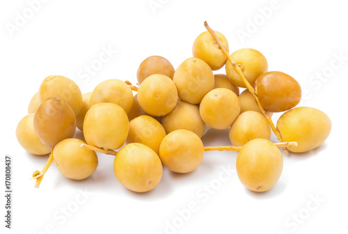 yellow raw dates isolated on white background