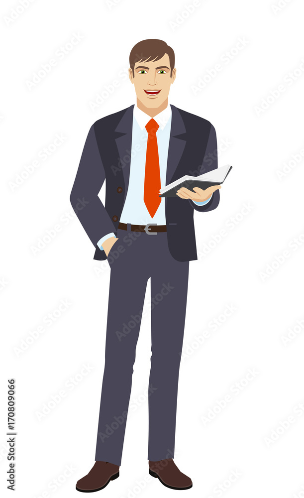 Businessman with hand in pocket holding book