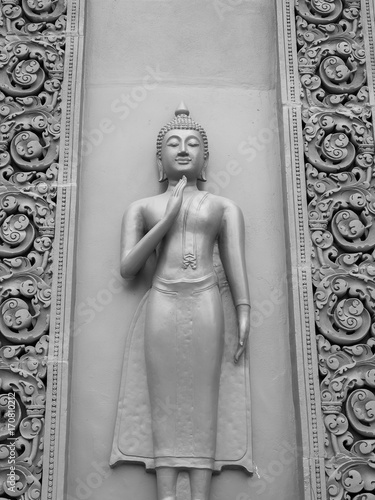 Thai  Buddhaa carving on the wall in the temple, Thailand photo