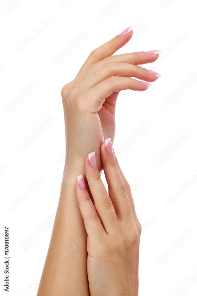 Closeup shot of woman's hands with french manicure and clean and soft skin over a white background, isolated Closeup shot of woman's hands with french manicure and clean and soft skin over a white background, isolated