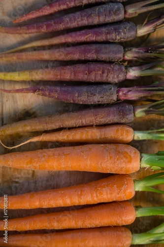 Overhead view of maroon and orange carrots