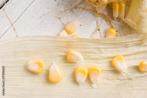 Fresh corn on rustic wooden table, closeup