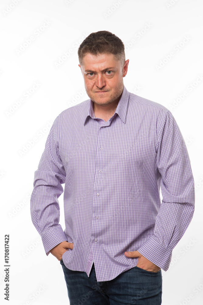 Young angry man portrait of a confident businessman showing by hands on a gray background. Ideal for banners, registration forms, presentation, landings, presenting concept. Young angry man portrait of a confident businessman showing by hands on a gray background. Ideal for banners, registration forms, presentation, landings, presenting concept.