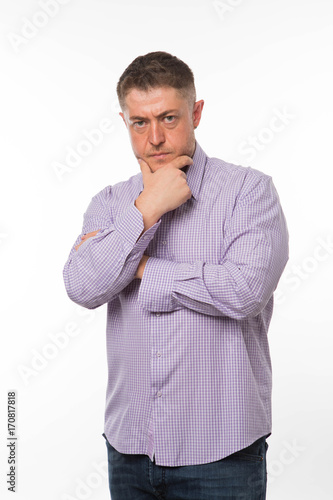 Young wistful man portrait of a confident businessman showing by hands on a gray background. Ideal for banners, registration forms, presentation, landings, presenting concept.