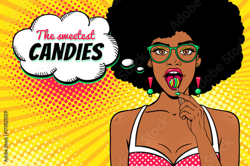 Wow female face. Sexy african american girl in glasses with afro hair, open mouth, bright lollipop in her hand and The sweetest Candies speech bubble. Vector background in pop art retro comic style.