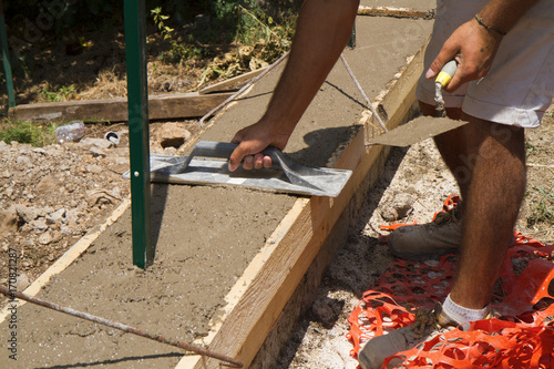 bricklayer building a new wall in a site