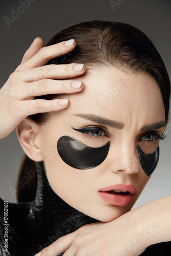 Fashion And Beauty. Female Face With Mask And Patches Under Eyes